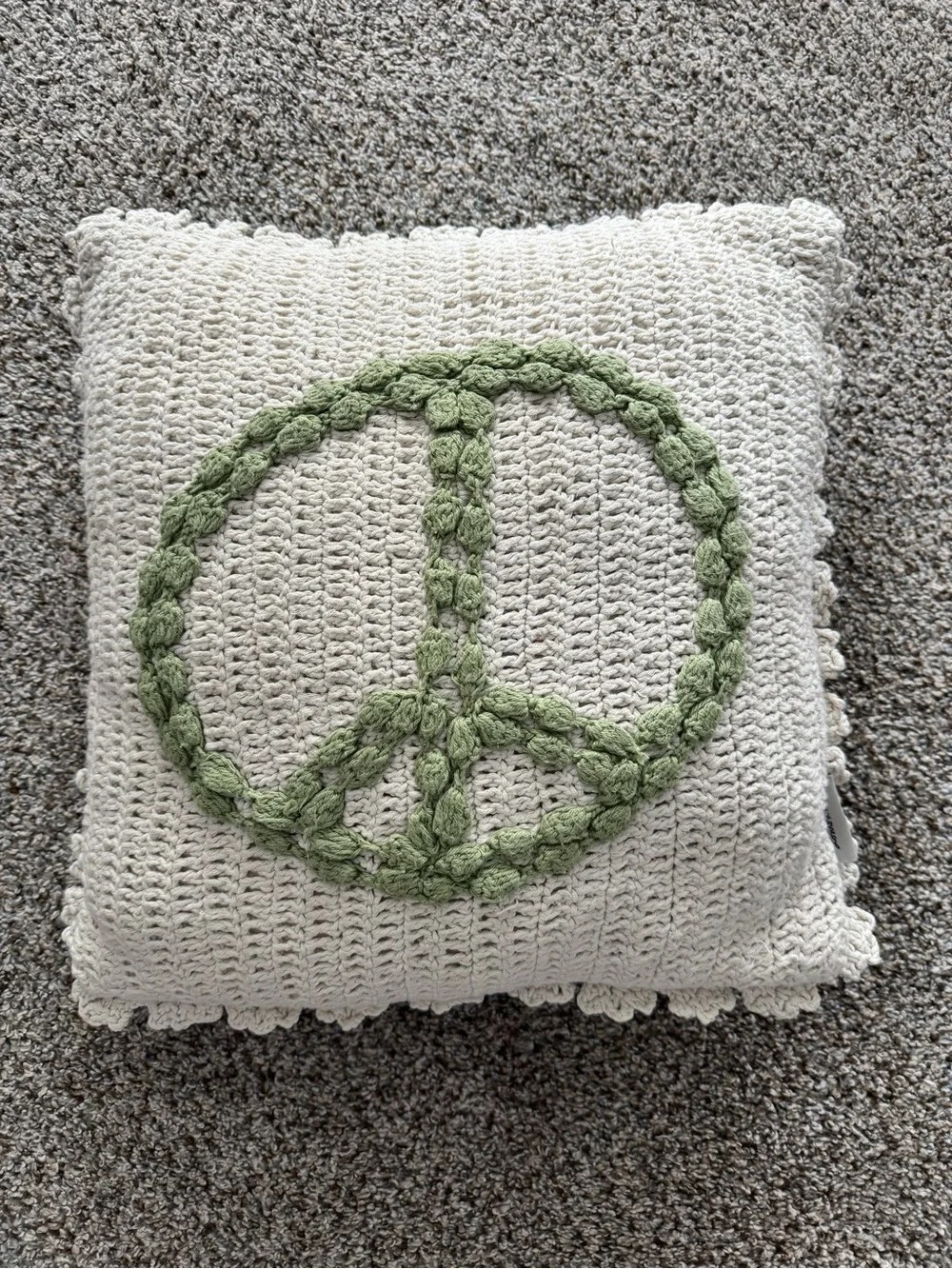 Cream Crochet Throw Pillow with Green Peace Sign Accent